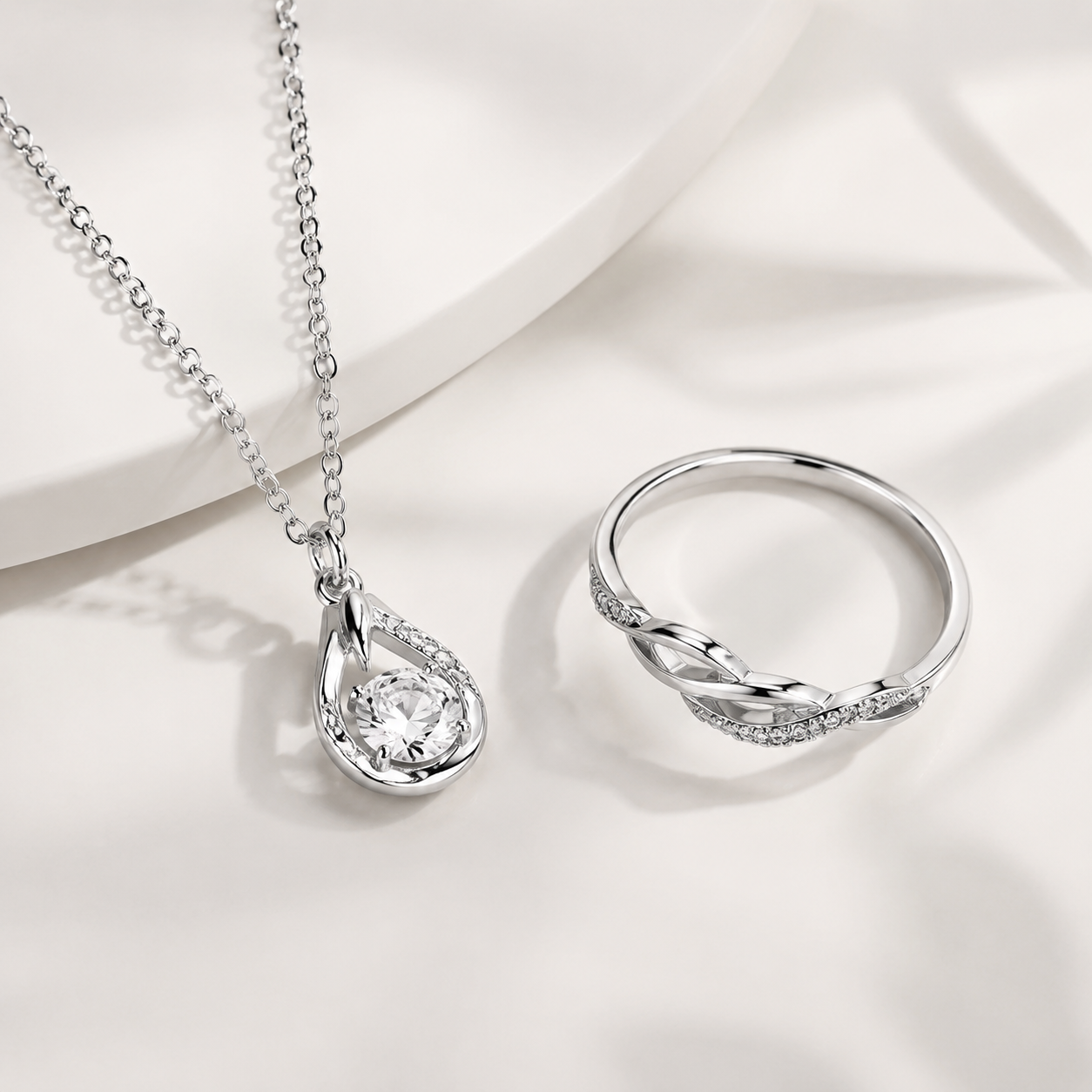 Realistic studio shot of a complete sterling silver pendant in a clean B2B setup, with a controlled light reveal showing the finish and chain connection